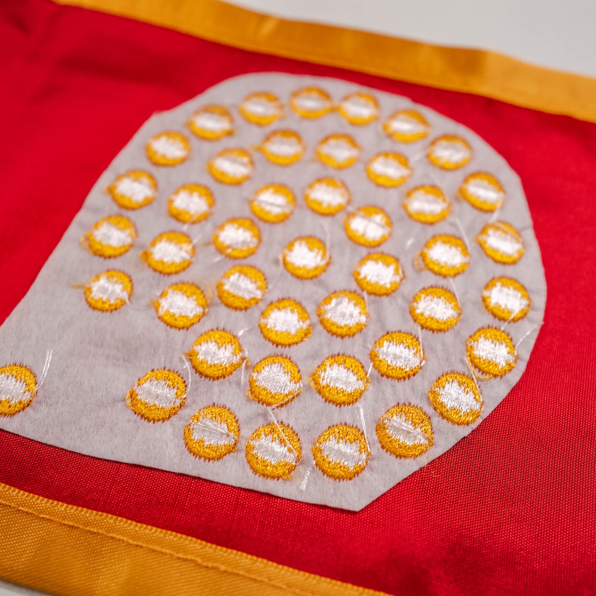 Back of competitor graduation stole showing low-quality backing