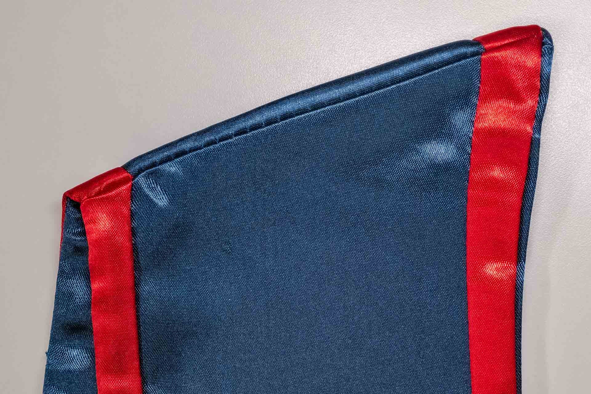 Competitor graduation stole corner showing thin fabric and loose stitching